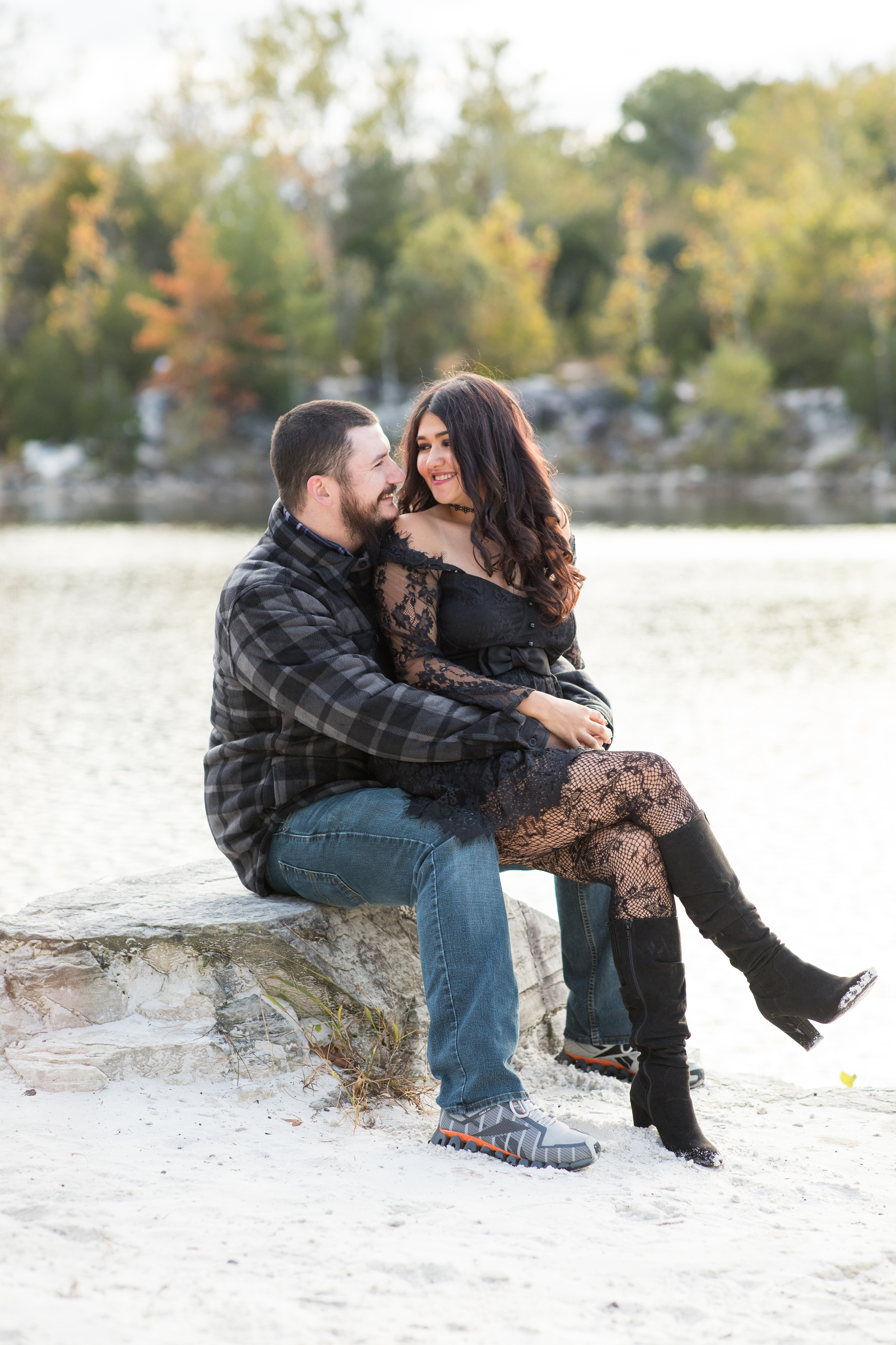 woman sitting in fiancé's lap