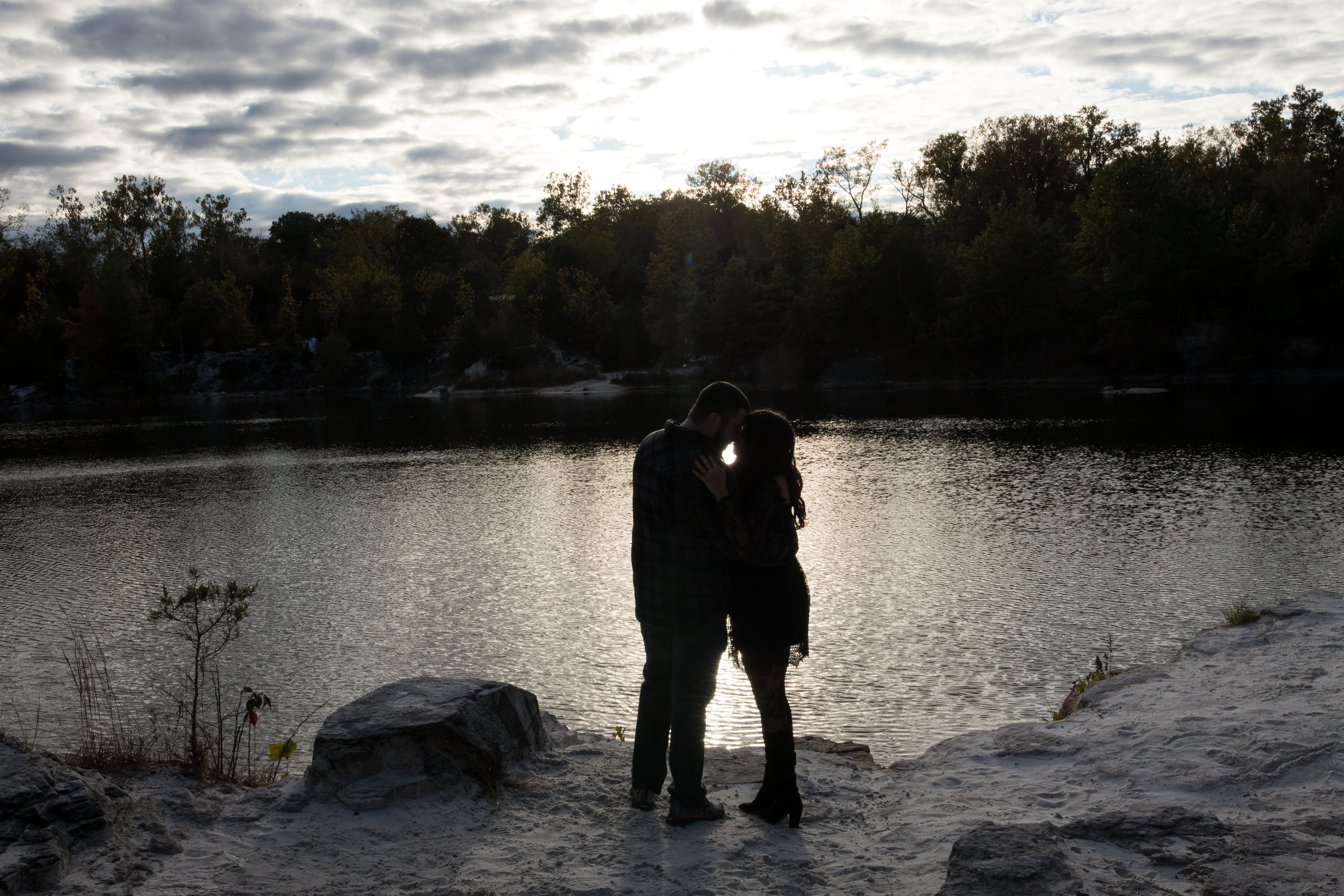 couple kissing at sunset