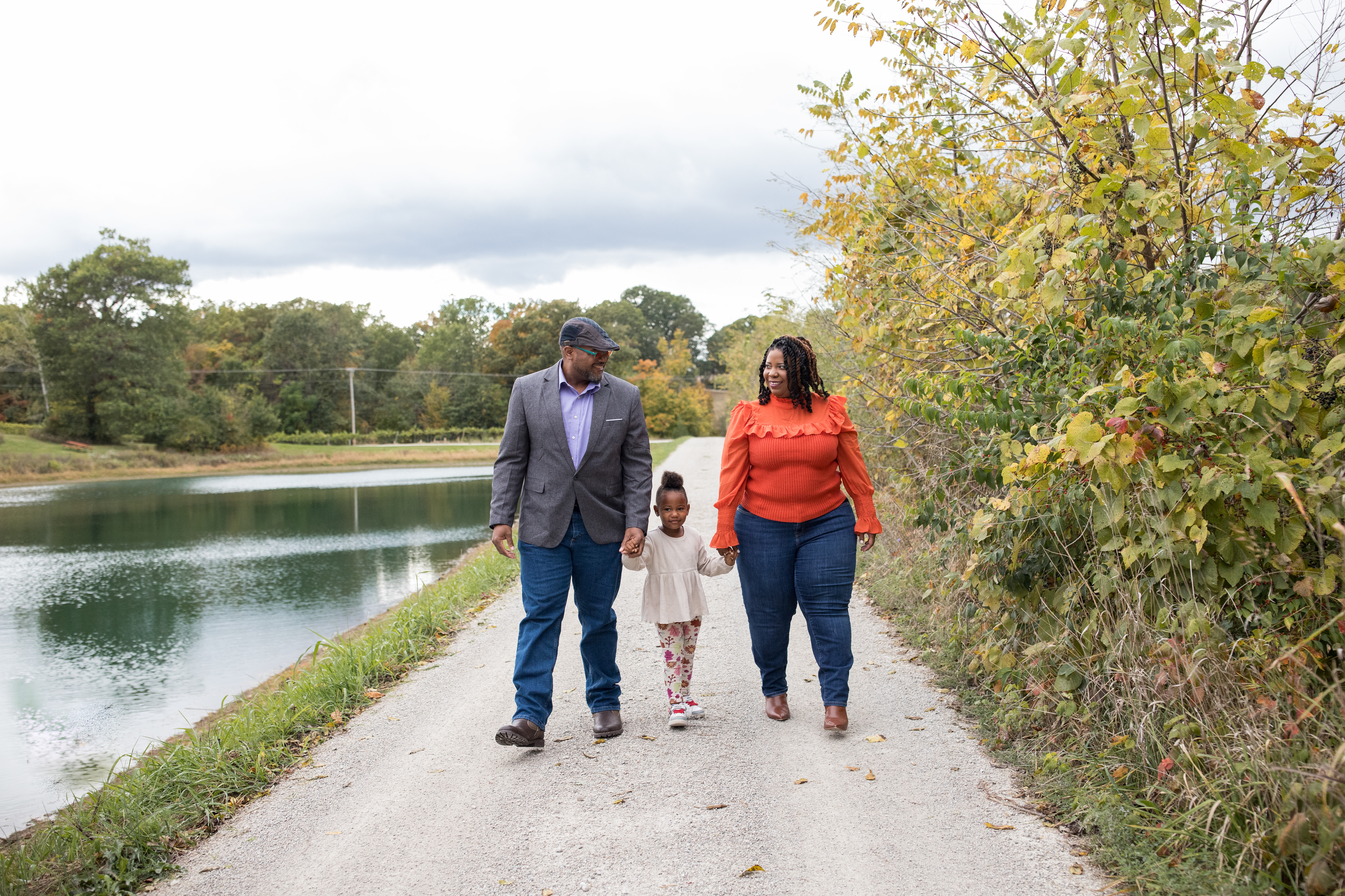 couple walking with their daughter