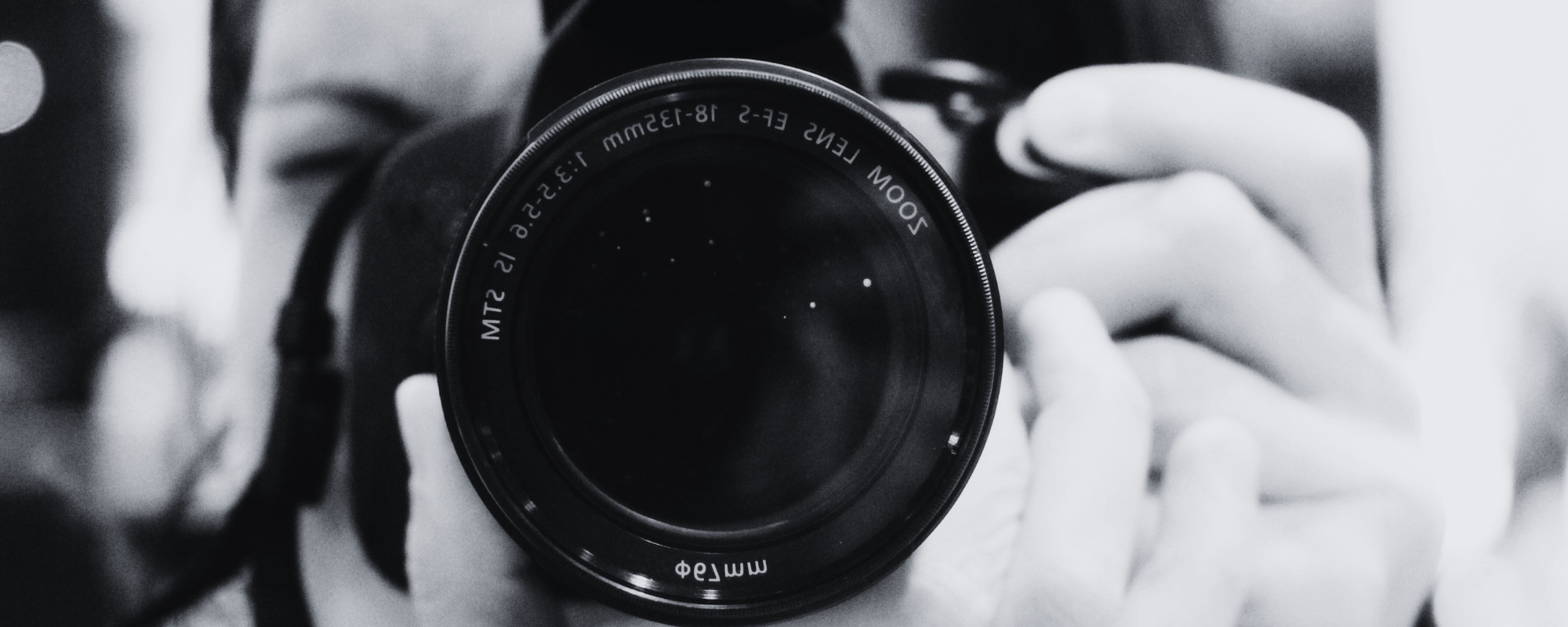 photographer's lense upclose capturing a photo 