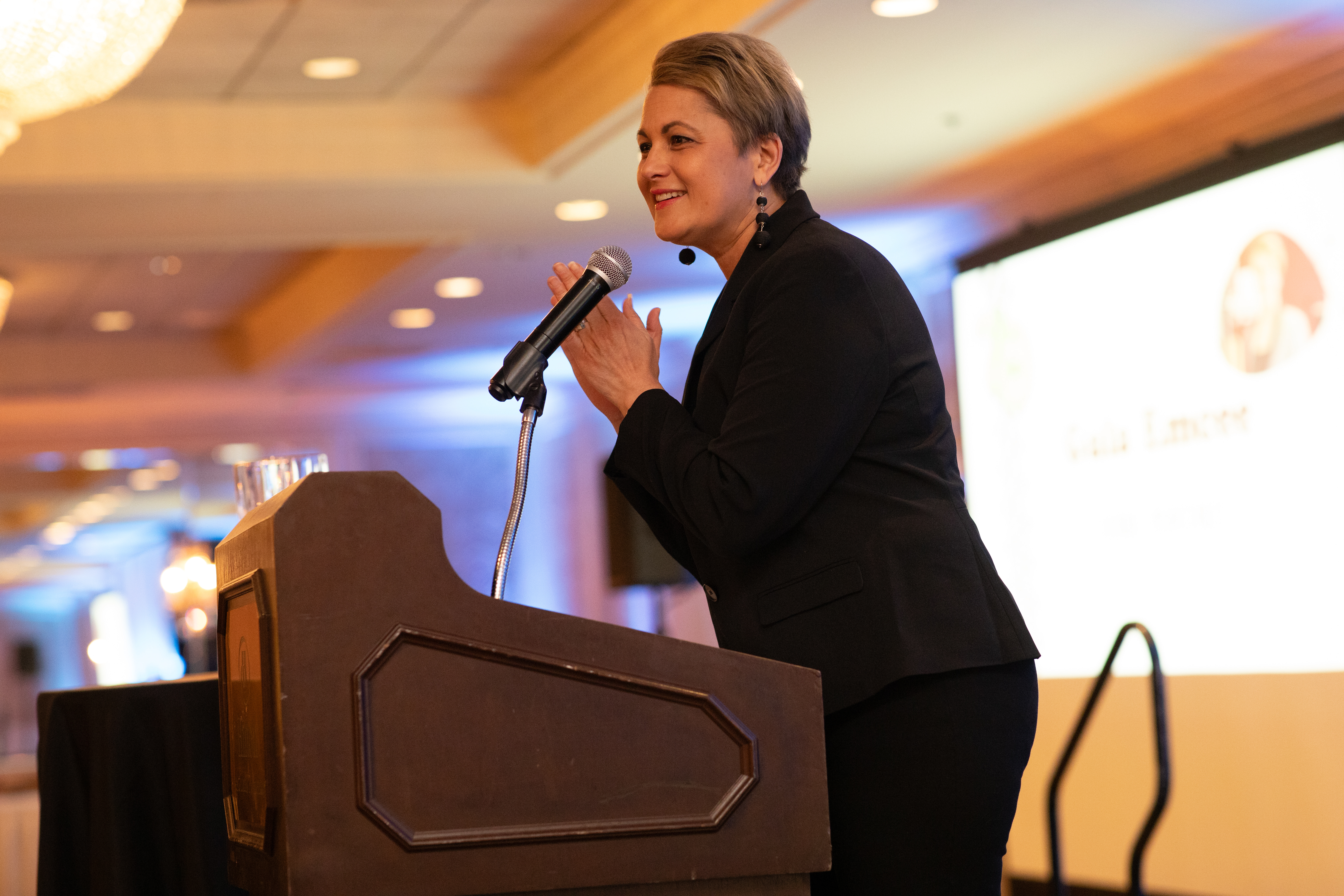 woman speaking at corporate event